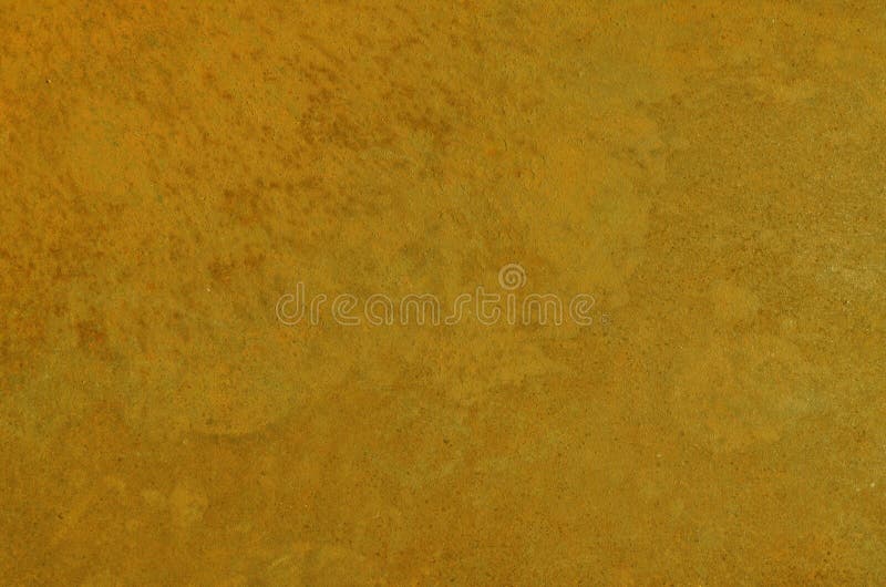 Stained dirty old rusty iron plate painted in mustard color royalty free stock photography